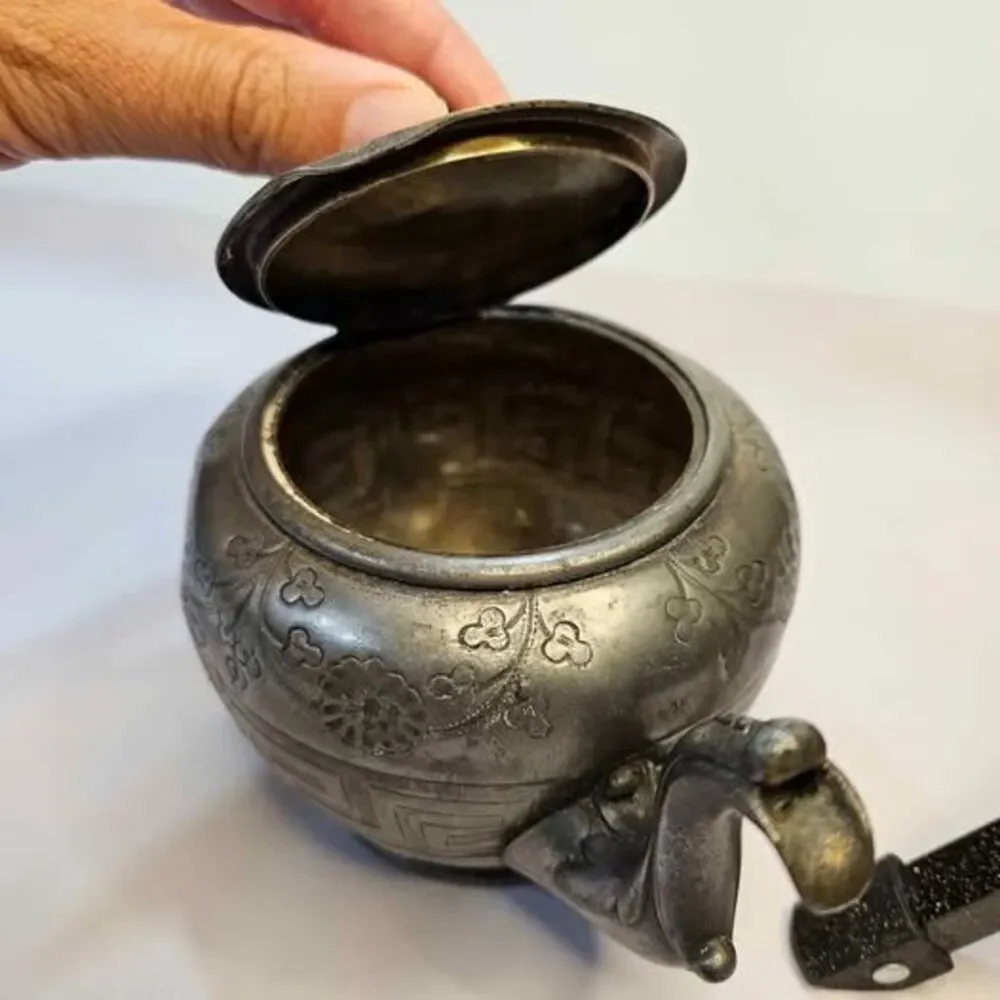 Antique silver-plated teapot Greek key pattern & embossed floral motifs.